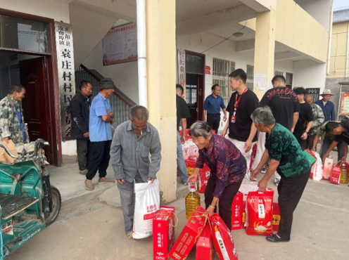 塔斯汀河南加盟商展“塔狮献爱心 助力乡村行”公益行动